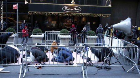 A group of Muslims pray before a rally in front of Trump Tower December 20, 2015 in New York. Republican presidential hopeful Donald Trump proposed a call for a ban on Muslims entering the United States. AFP PHOTO/KENA BETANCUR / AFP / KENA BETANCUR        (Photo credit should read KENA BETANCUR/AFP/Getty Images)