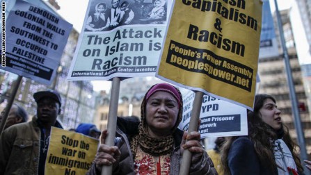 A Muslim woman attends a rally in front of Trump Tower December 20, 2015 in New York. Republican presidential hopeful Donald Trump proposed a call for a ban on Muslims entering the United States. AFP PHOTO/KENA BETANCUR / AFP / KENA BETANCUR        (Photo credit should read KENA BETANCUR/AFP/Getty Images)